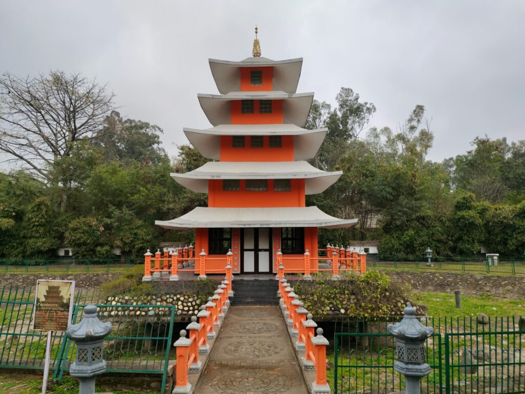 Capture of a vibrant pagoda in the gardens of Chandigarh, India, showcasing cultural architecture.